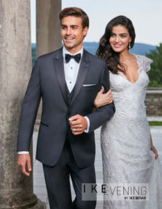Groom and bride in wedding attire.