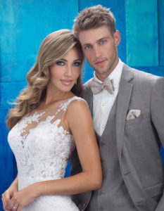 Bride and groom in wedding attire.