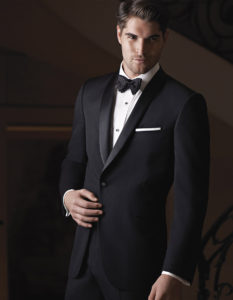 Man in black tuxedo, bow tie.