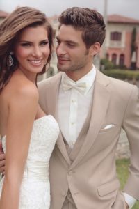 Bride and groom in wedding attire.