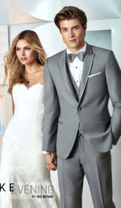 Couple in grey suit and wedding dress.