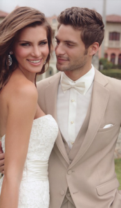 Happy bride and groom in wedding attire.
