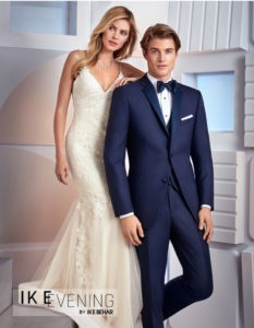 Couple in wedding attire; elegant navy suit.