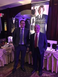 Two men in suits at Foresto Tuxedo event.