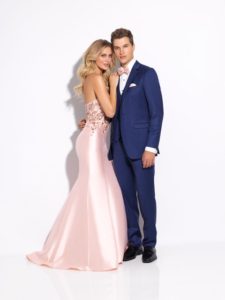 Couple in prom attire; she's in pink, he's in blue.