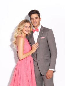 Couple in prom attire, embracing.