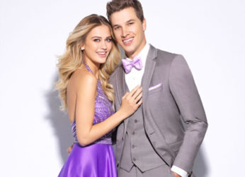 Couple in prom attire, she's in purple.