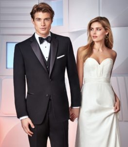 Elegant tuxedo and wedding dress couple.