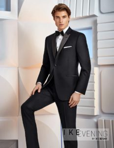 Here's an alt text option for the image: Man in black tuxedo.