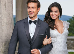 Groom and bride in formal wedding attire.