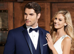 Here's an alt tag for the image: Elegant couple in formal wear.