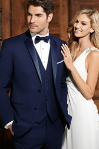 Man in navy tuxedo with bride.