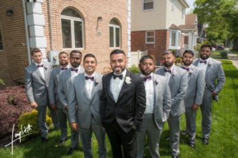 Groom and groomsmen in gray suits.