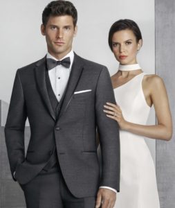 Here's an alt tag for the image: Elegant couple in formal wear.