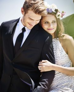Happy couple in wedding attire.