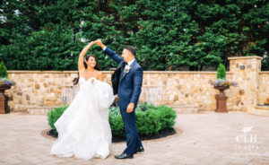 Bride and groom dancing at wedding.
