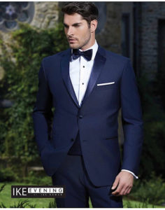 Man in navy tuxedo, bow tie.