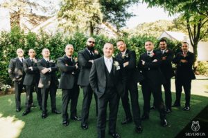 Groom posing with his groomsmen.