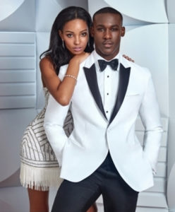 Couple in white tuxedo and beaded dress.