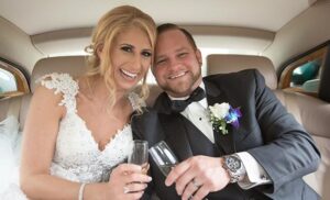 Happy bride and groom in a limousine.