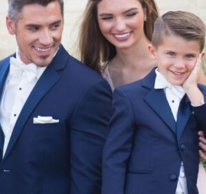 Family in navy blue tuxedos.