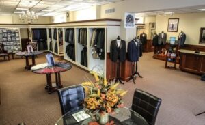 Men's suit shop with many suits.