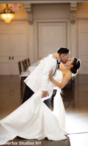 Bride and groom sharing a kiss.