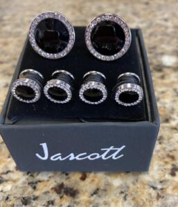Black cufflinks and studs set.